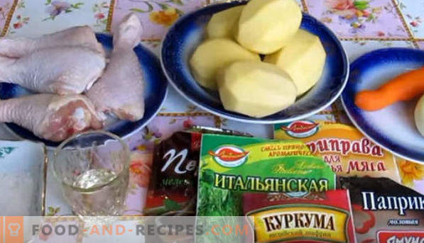 Pernas de frango, assadas com batatas no forno, sob uma crosta crocante, em uma luva, folha, com queijo